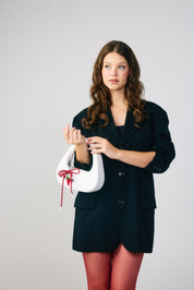 The Halo Bow Charmed Clutch Bag