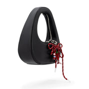 The Halo Bow Charmed Clutch Bag