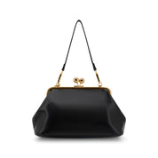 A black satin kiss-lock handbag with gold-tone metal hardware and a thin black shoulder strap, shown against a plain white background.