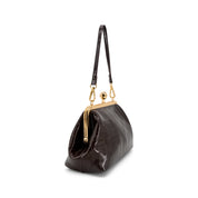 A CHOCOLATE BROWN crocodile-embossed leather handbag with a gold-tone kiss-lock clasp and shoulder strap, shown from a three-quarters angle on a white background.