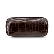 A CHOCOLATE BROWN faux-crocodile leather cosmetic pouch with a glossy finish, shown from a top-down view on a white background.