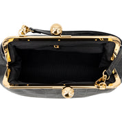 Black crocodile-embossed kiss-lock handbag with gold-tone metal frame and a black interior zippered pocket, shown from a top-down view on a white background.