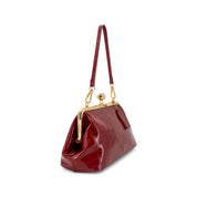 A Wine crocodile-embossed leather shoulder bag with gold-tone hardware and a kiss-lock frame, shown on a plain white background.