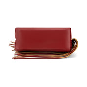 A red leather clutch bag with a long, decorative fringe strap in red, brown, and gold tones, shown against a plain white background.