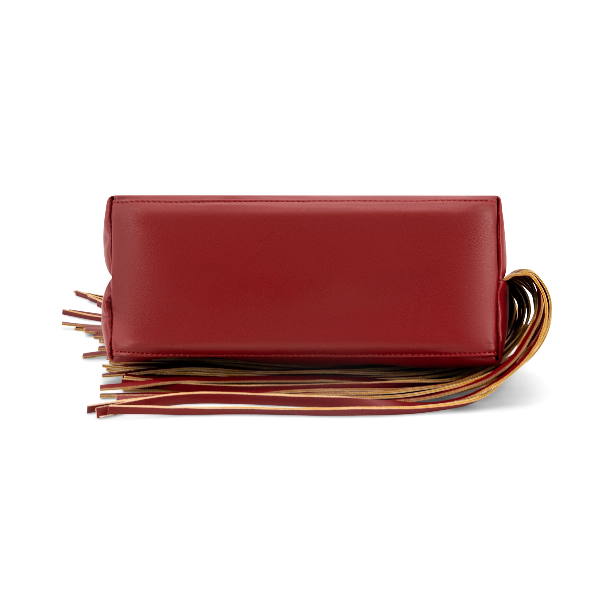 A red leather clutch bag with a long, decorative fringe strap in red, brown, and gold tones, shown against a plain white background.