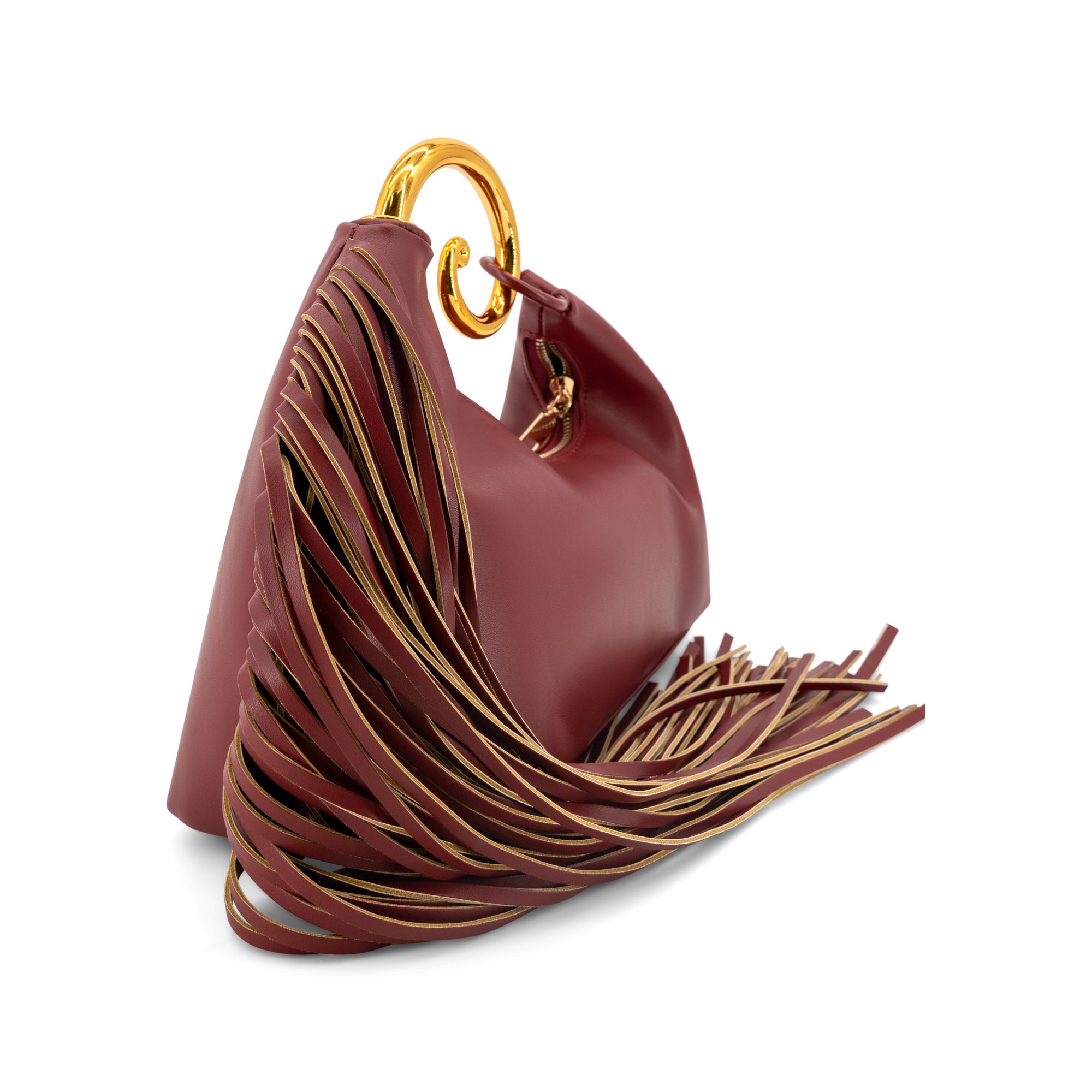 A burgundy leather handbag with a distinctive sculptural fringed side detail and a gold-tone O-ring handle, shown on a clean white background.