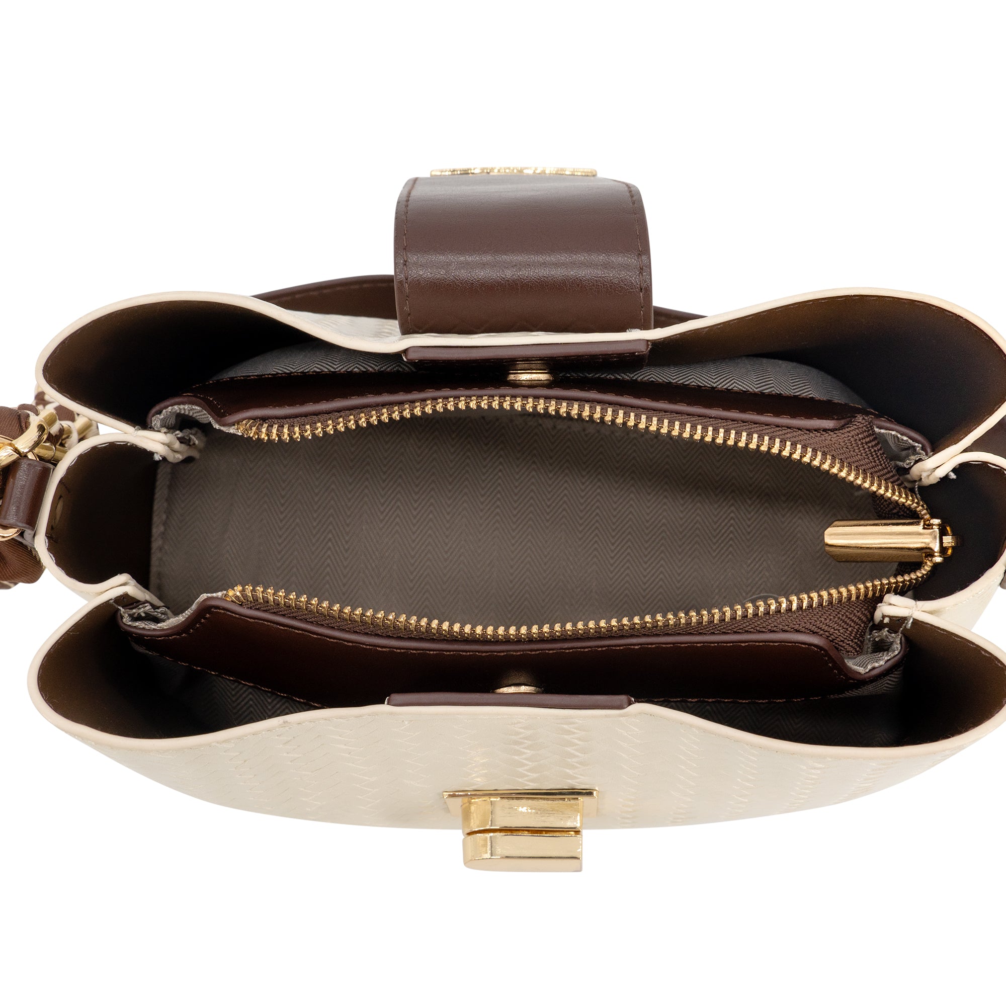 An overhead view of a structured handbag's open top, showing a cream-colored textured exterior, a dark brown interior lining, a brown leather strap, and gold-tone hardware including zippers and a clasp.