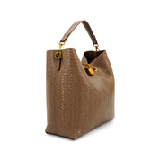 A brown woven leather hobo handbag with gold-tone hardware and a top handle, shown on a clean white background.