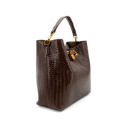 A dark brown woven leather handbag with a top handle and gold-tone hardware, shown on a plain white background.