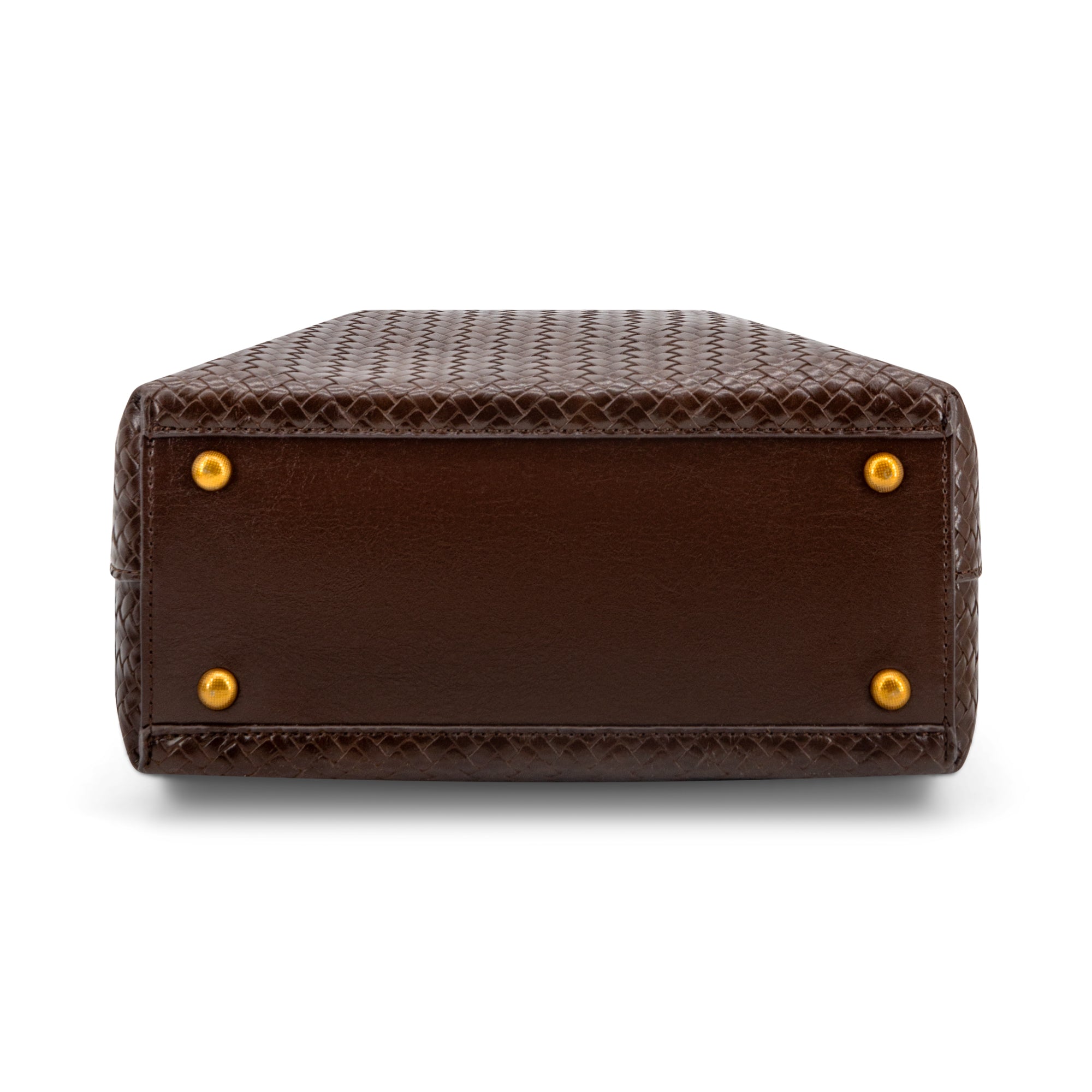 The bottom corner view of a dark brown snakeskin leather handbag, showing the textured pattern, a smooth brown leather trim, and four gold-tone metal studs on a white background.
