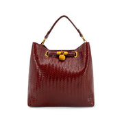 A Wine textured leather handbag with a gold clasp and top handle, shown against a plain white background.