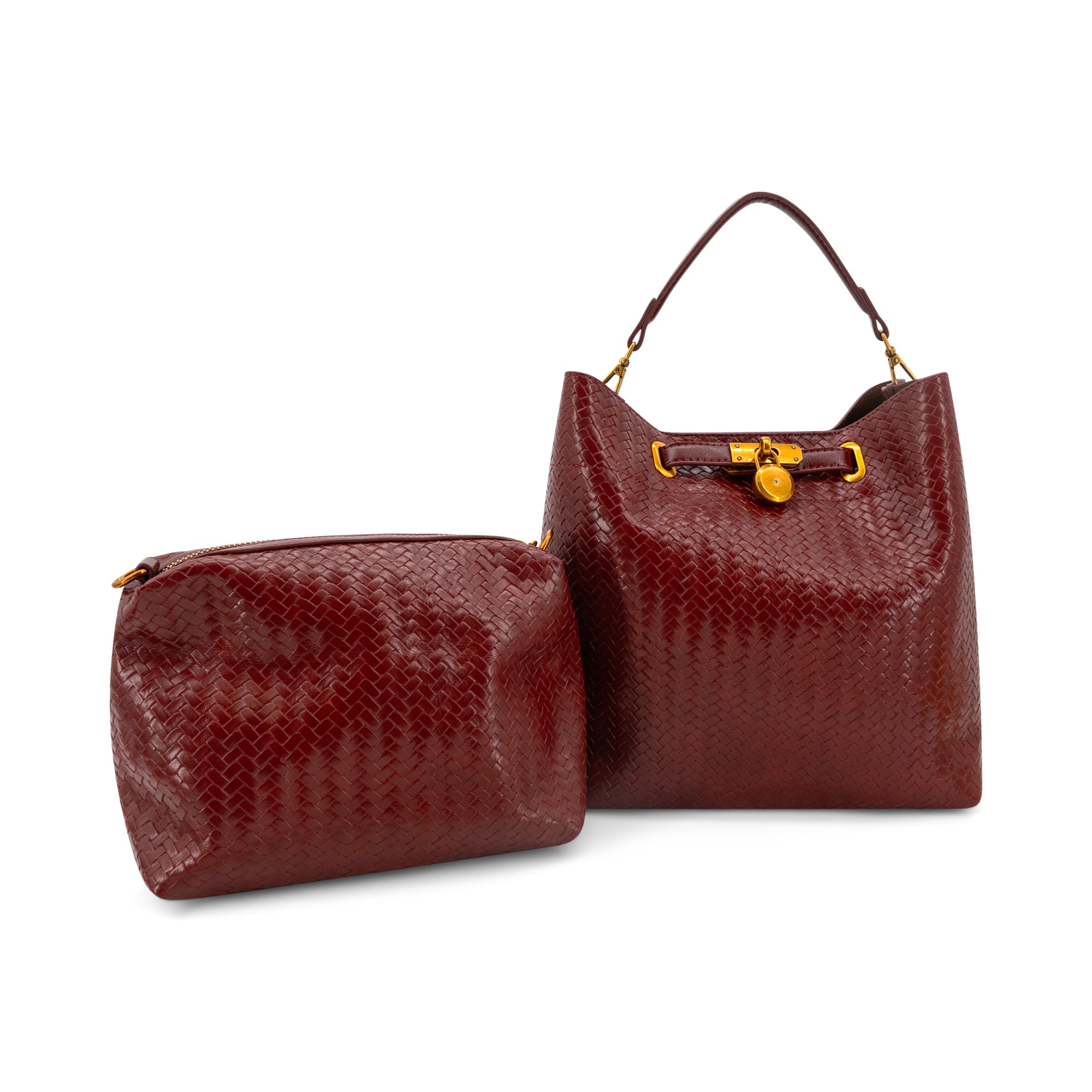 A Wine textured leather handbag and matching zippered pouch with gold-tone hardware, displayed on a clean white background.