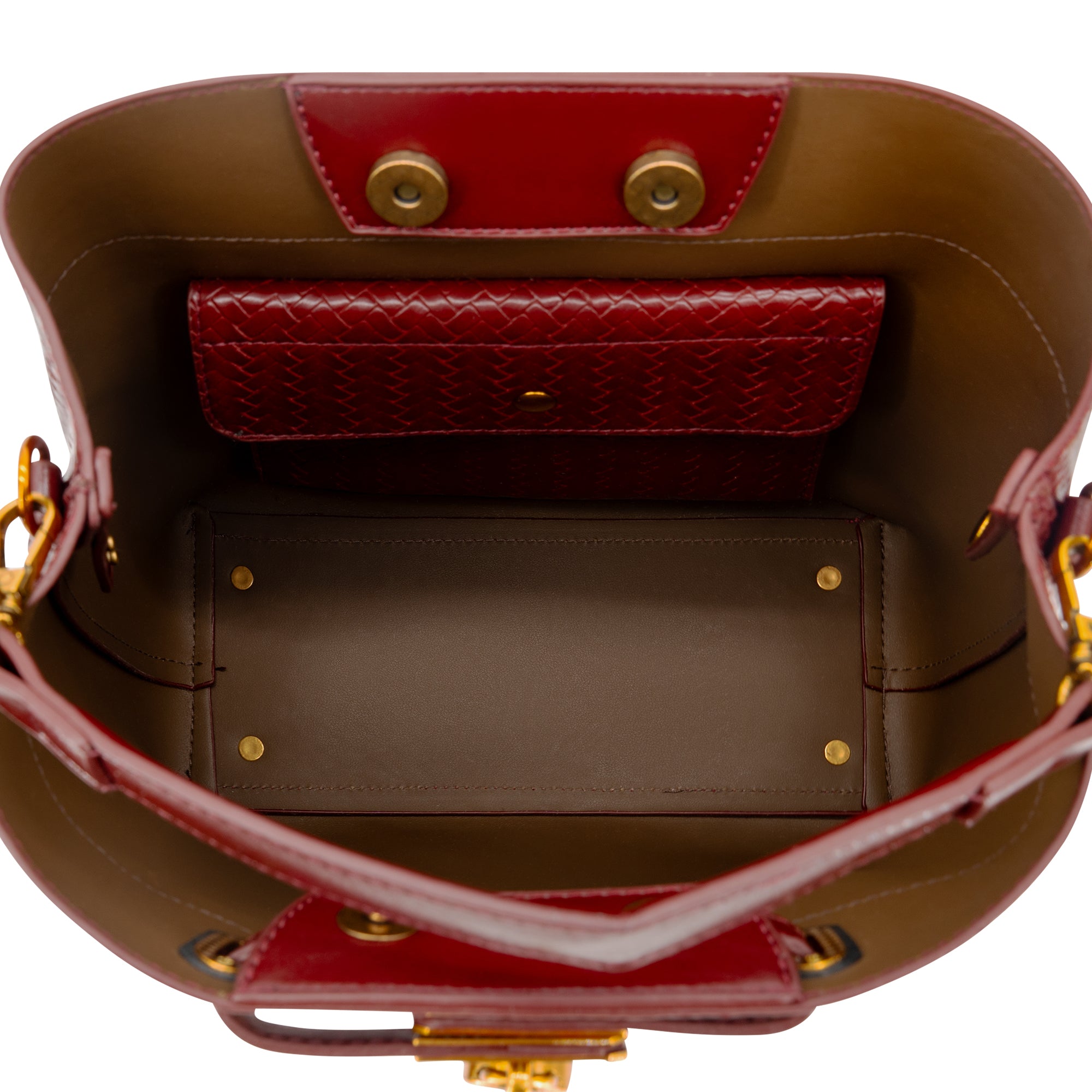 Open view of a structured bucket bag showing the interior. The bag features a deep reddish-brown leather exterior, a brown suede-like interior lining, a matching reddish-brown interior wallet, and gold-tone hardware.