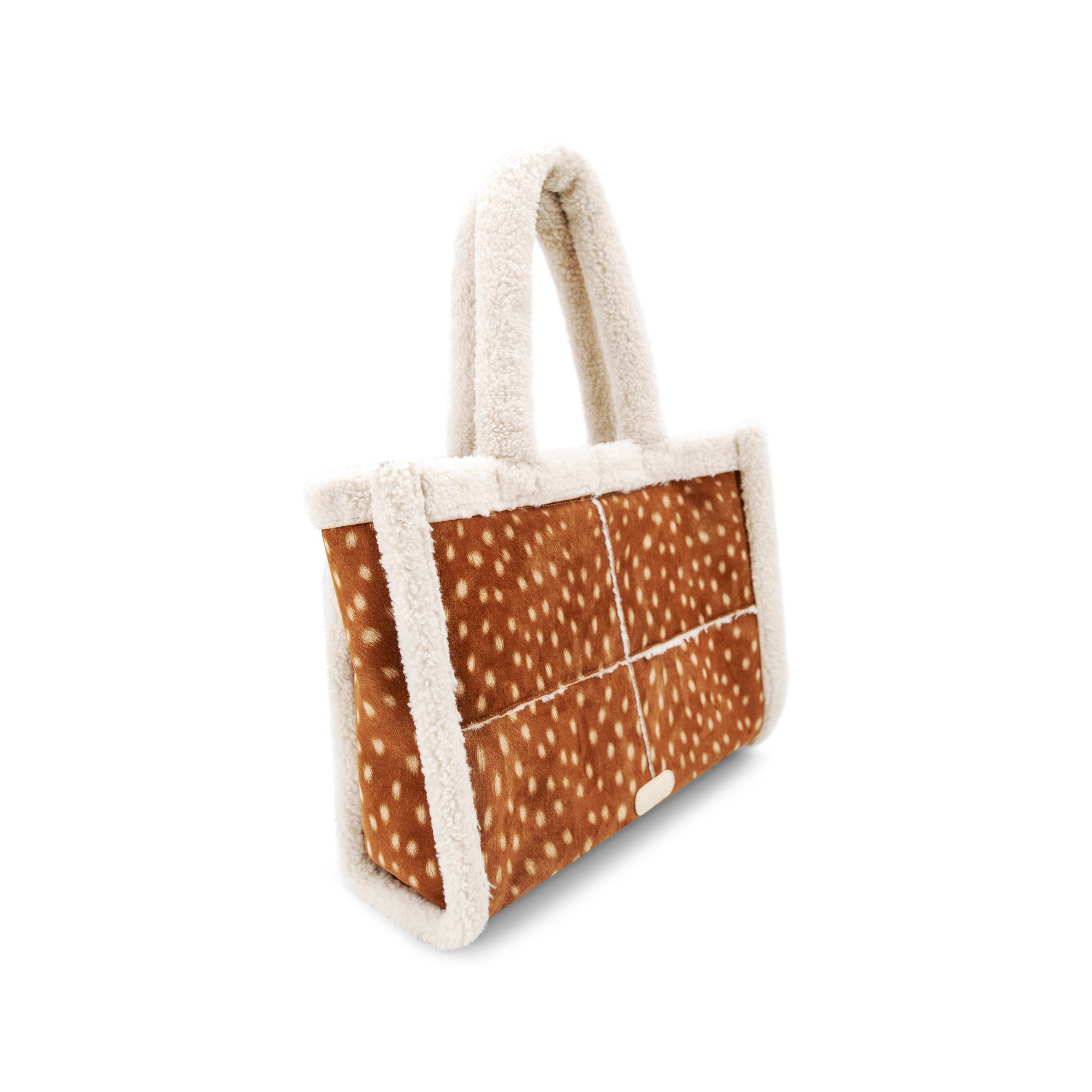 A soft tote bag with a brown deer-print pattern and fluffy cream sherpa trim and handles, shown on a plain white background.
