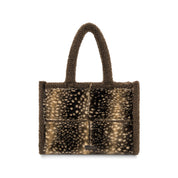 A small teddy-fleece tote bag with a brown and beige spotted animal-print front panel and dark brown handles, shown on a plain white background.