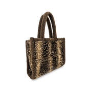 A small structured tote bag with a brown and beige spotted animal-print pattern, featuring a fuzzy brown faux-fur trim and handles, shown on a plain white background.