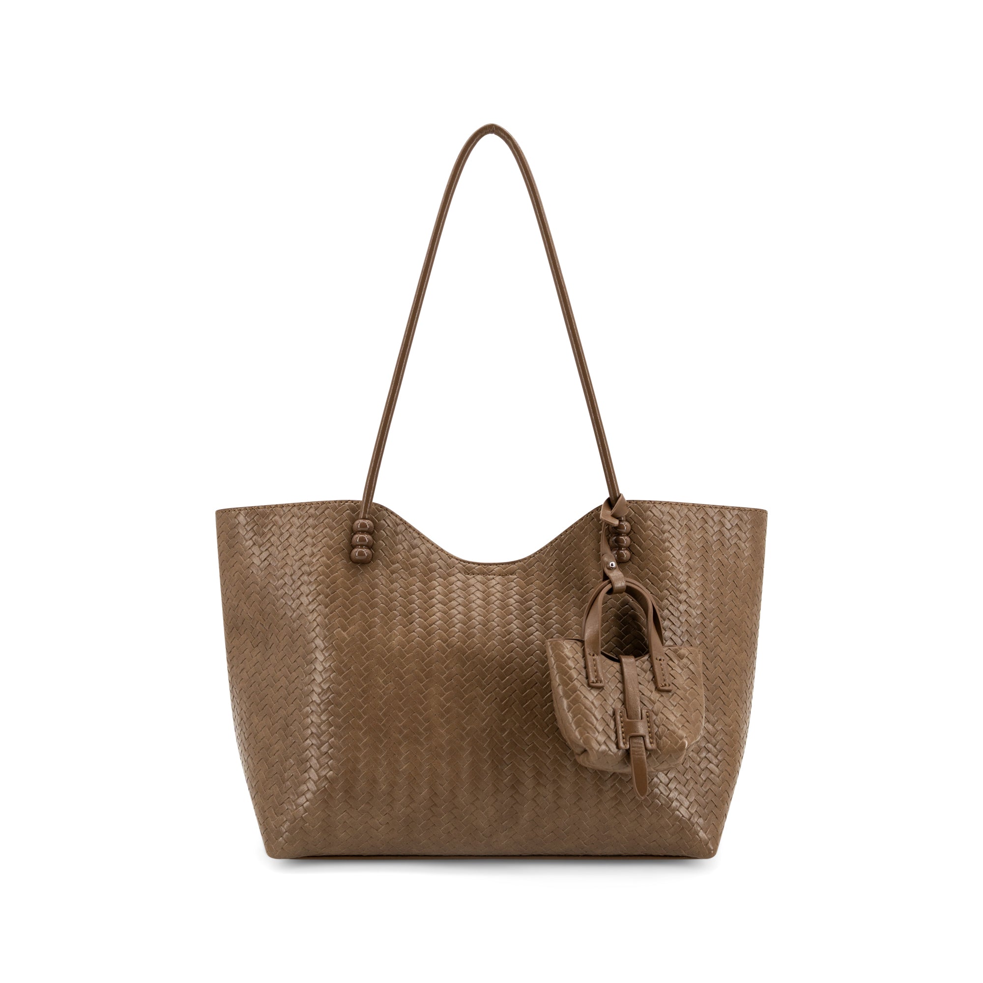 A brown woven leather tote bag with a single shoulder strap and a matching leather hanging charm, shown against a plain white background.