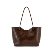 A dark brown woven leather tote bag with a single shoulder strap, shown against a plain white background.