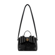 Crossi Bow Embossed Small Crossbody Bag in Black, front view with shoulder strap